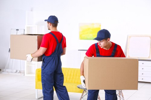 Furniture pick-up team loading a sofa in Shepherds Bush
