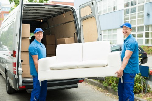 Man with van loading furniture in Shepherds Bush street