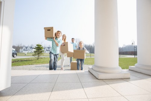 Team loading household items into a removal van