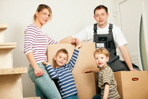 Movers loading household items for a local Shepherds Bush removal