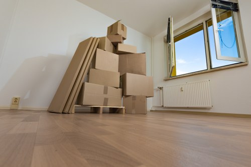 Packed boxes and furniture ready for transport in Shepherds Bush