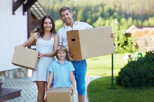 Moving van and removal team handling a flat move in West London