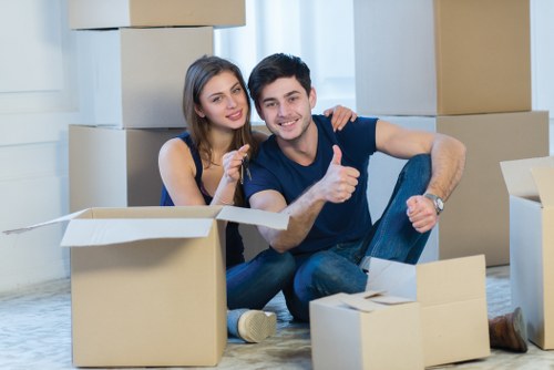 Packed office furniture and equipment ready for relocation in West London