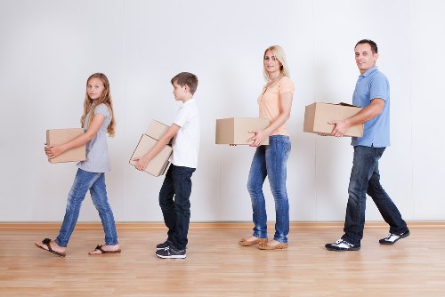 Commercial movers transporting office items in West London