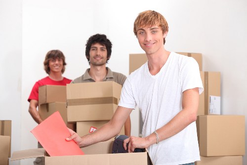 Loading furniture and boxes into a removal truck in West London
